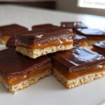 Close-up of layered Caramel Ritz Cracker Christmas Cookies squares with chocolate topping.