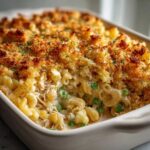 Close-up of creamy Tuna Casserole with elbow macaroni, peas, and a crunchy, golden breadcrumb topping.