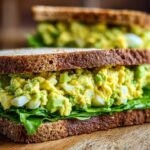 A delicious Avocado Egg Salad Sandwich made with whole wheat bread and fresh lettuce.