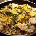 Close-up of One-Pot Chicken and Rice with Lemon and Herbs, topped with fresh dill and lemon zest.