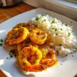Plated Garlic Butter Shrimp and Rice Easy Recipe, featuring succulent shrimp coated in garlic butter sauce next to fluffy white rice.