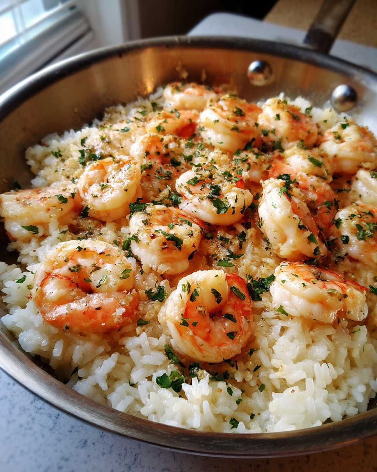 Close-up of Garlic Butter Shrimp with Rice Skillet, topped with fresh parsley.