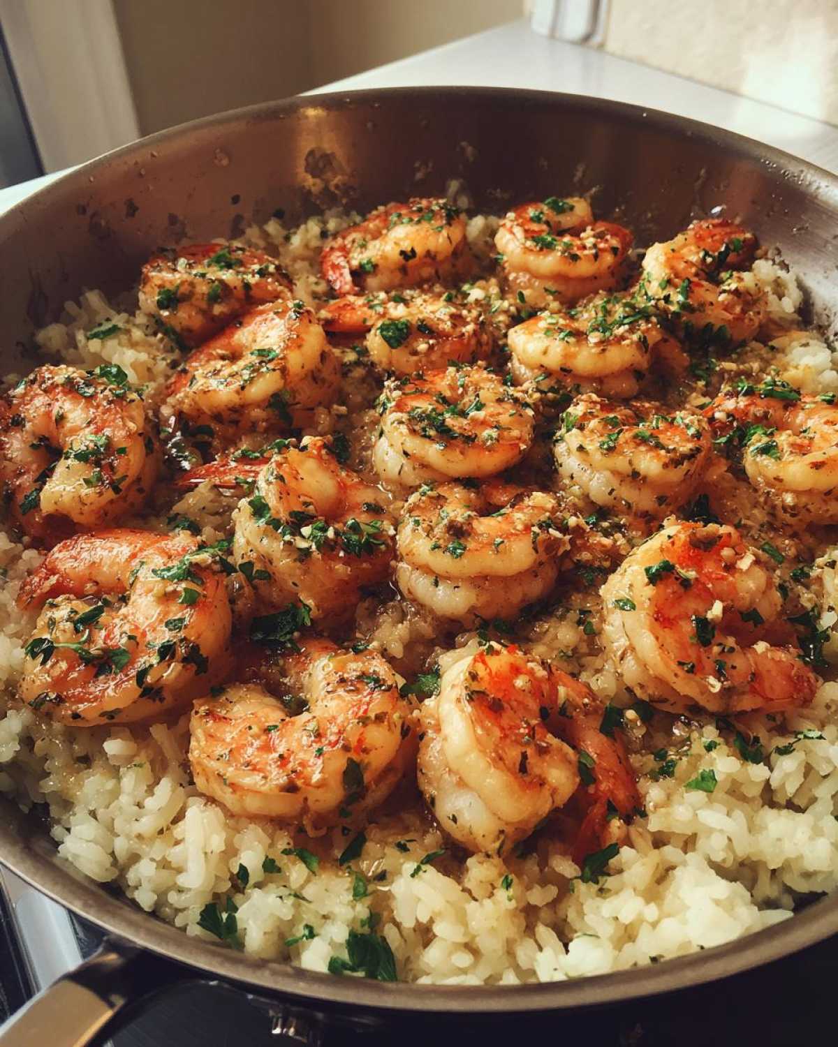 Close-up of Garlic Butter Shrimp with Rice Skillet, featuring plump shrimp glazed in garlic butter and parsley over white rice.