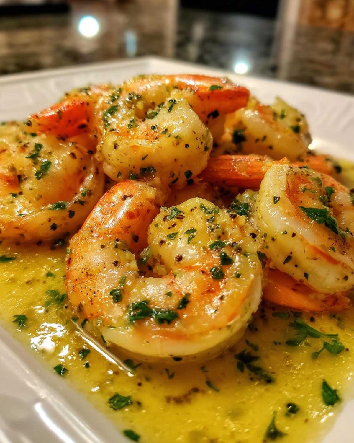 Close-up of succulent shrimp coated in a rich lemon butter sauce, garnished with parsley, highlighting the Lemon Butter Shrimp with Garlic Flavor.