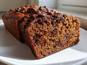 Close-up of sliced Sourdough Chocolate Chip Quick Bread showing moist crumb and melted chocolate chips.
